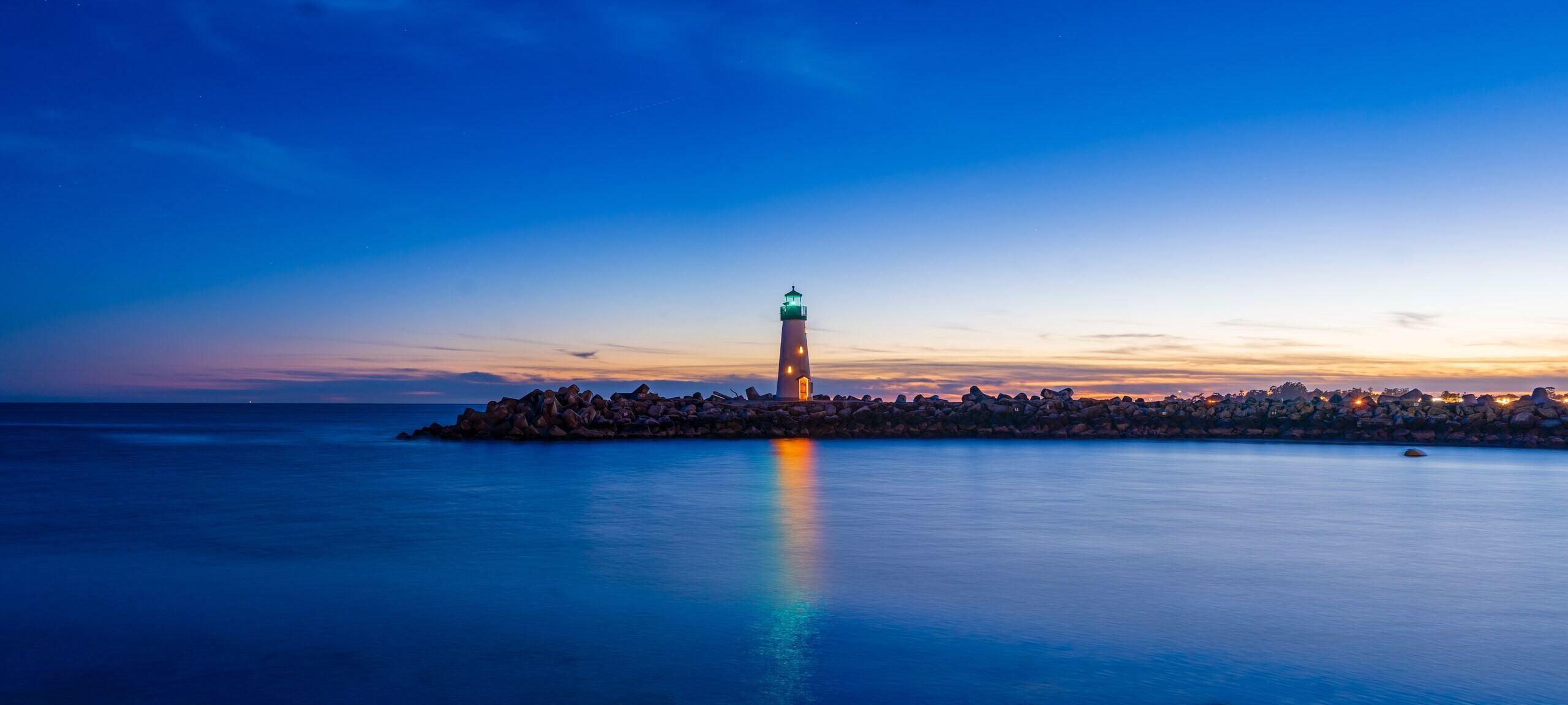 Historic lighthouse during sunset in Santa Cruz, CA. Photo by Joseph Sintum on Unsplash