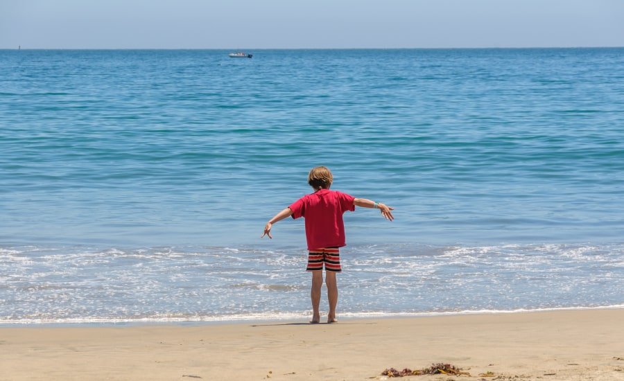 Boy at sunny beach in Santa Cruz County