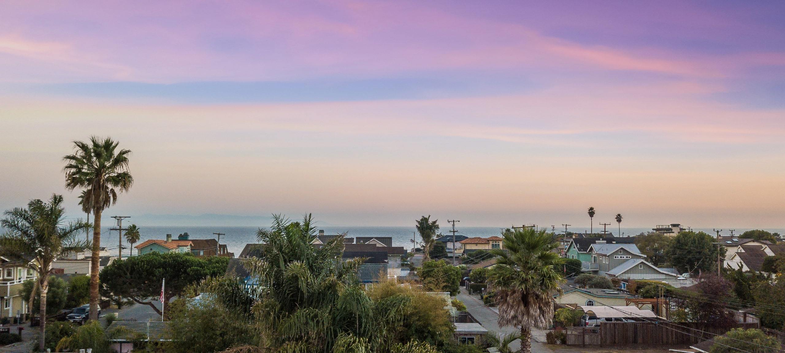 Purple sunset over residential, waterfront area in Santa Cruz, CA