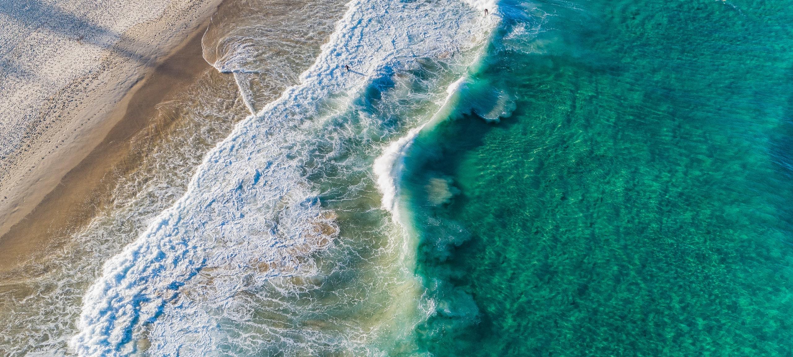 Aerial view of blue California water and beach