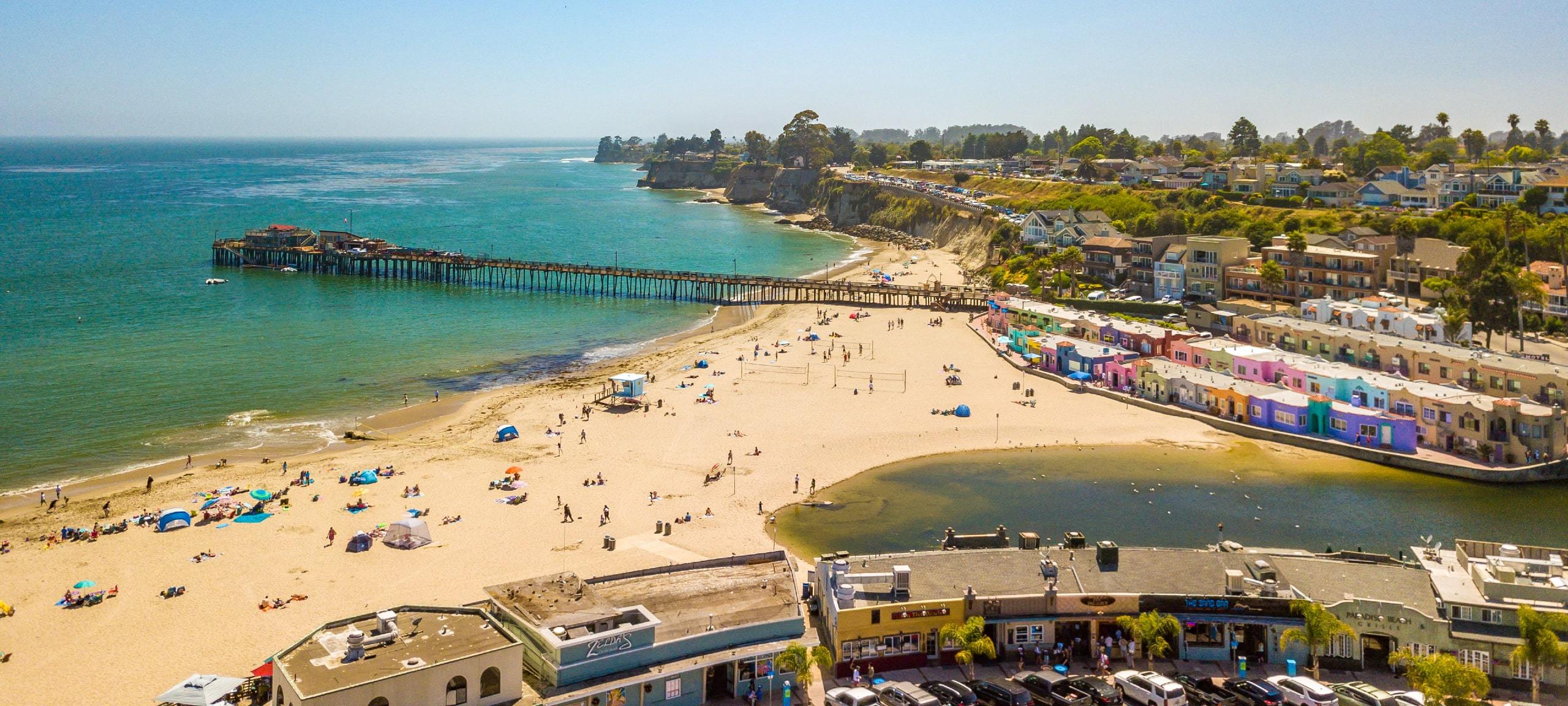 Aerial view of sunny beach and real estate in Santa Cruz, CA