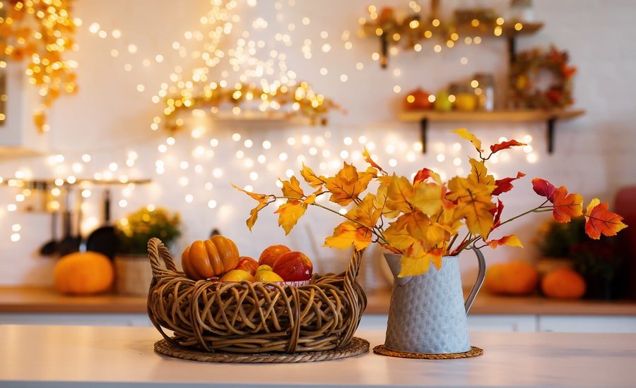 Autumnal interior decorating with hanging lights in modern kitchen